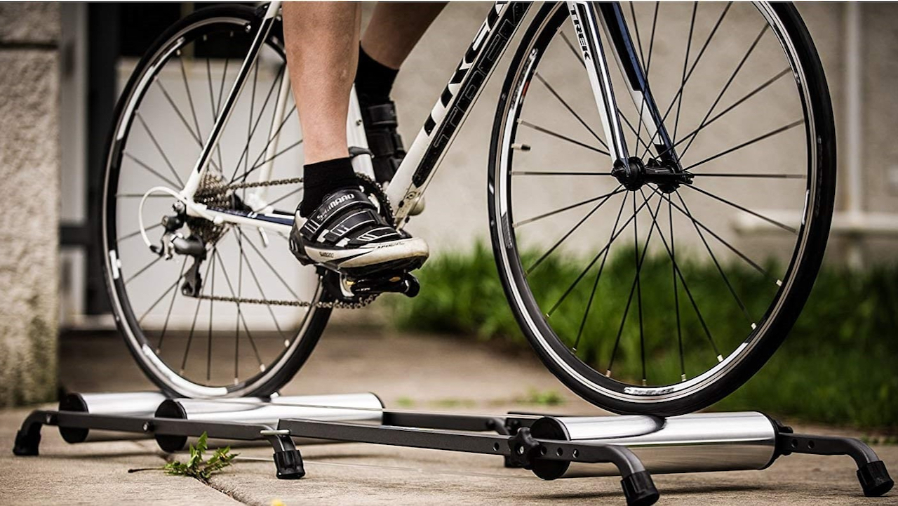 Stock image of a cyclist on a bicycle that is on a set of bike rollers for use with coordination training