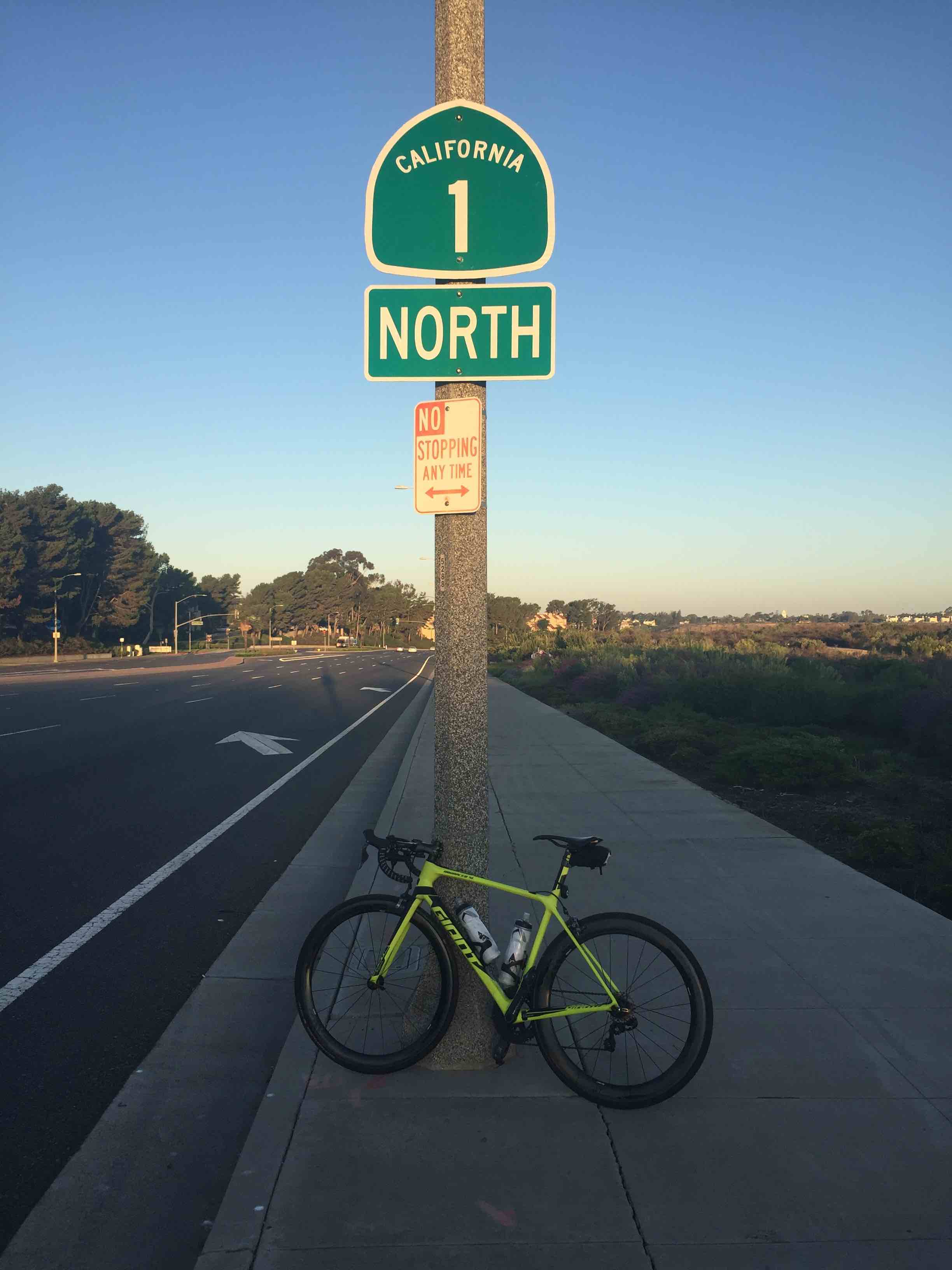 Giant TCR bicycle leaning against light pole along Coast Highway in Newport Beach, California