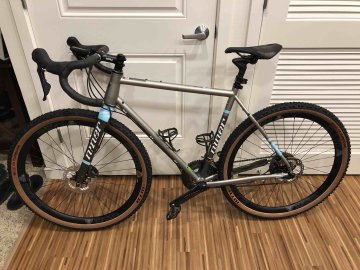 Niner RLT9 Steel bicycle with WTB Sendero gravel tires leaning against a wall