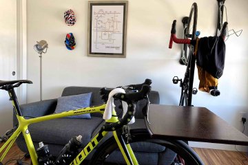 The proper number of bikes to own is N+1, where N is equal to the current number of bikes you currently have. Image contains: Giant TCR bike, Cycleops Hammer trainer, subway-inspired tube map, bike hats.