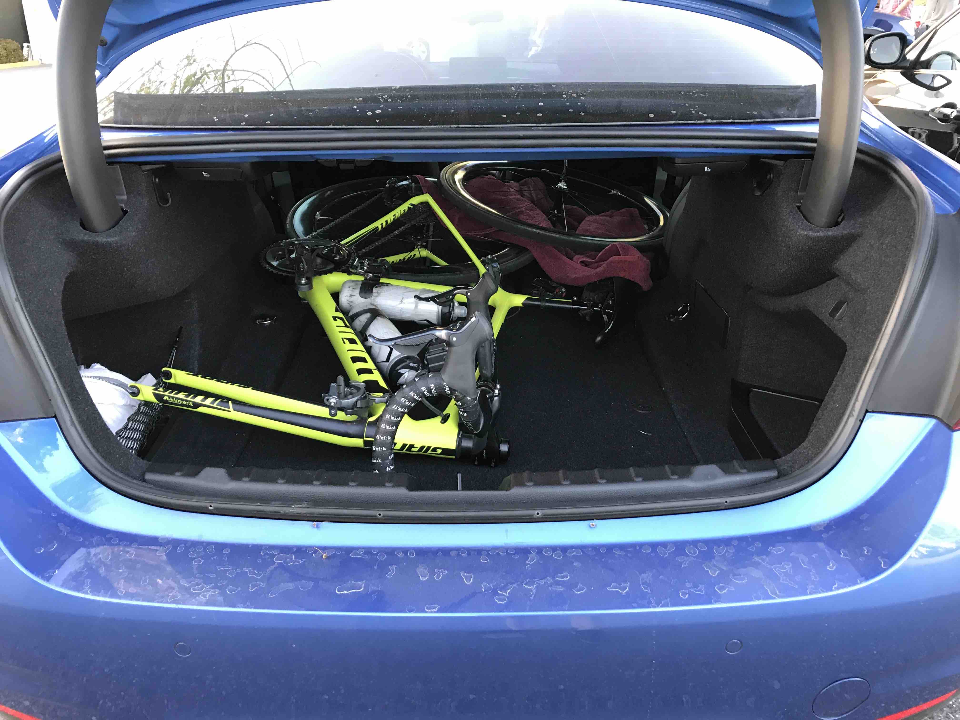 Bike fits when placed in trunk of sedan with seats folded down