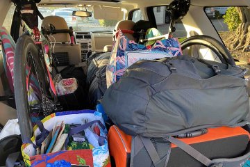 Packing up your bike into your car with all your supplies doesn't have to be a chore. Image contains: bicycles, Ford Escape, bags, backpacks, souvenirs.
