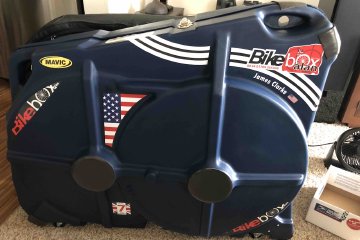 Bringing your bike with you on an international trip is easy with some careful planning and some basic knowledge. Image contains: BikeBoxAlan bike box, packed bicycle, stickers.