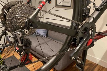 Beyond just picking a frame for a new bicycle purchase, it's important to consider what kind of components you will want to have. Image contains: Factor O2 VAM, BBInfinite red jockey rear derailleur wheels, Pioneer Power Meter, Shimano Dura Ace grouposet, Arundel bottle cages, Feedback Sports bike stand.