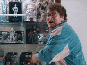 Awesome! Man in front of action figures saying awesome gif