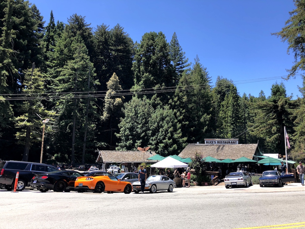 Fancy cars parked in front of Alice's Restaurant near Woodside, California at the top of Skyline and the 84 highway.