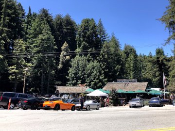 They have really good coffee cake, actually, and decent restrooms if they're open. Fancy cars parked in front of Alice's Restaurant near Woodside, California at the top of Skyline and the 84 highway.