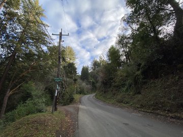 You actually see this road again a bit further up, along a section of road that looks shockingly similar. Junction with Upenuf road and Old La Honda road, looking up at the sky into the clouds.