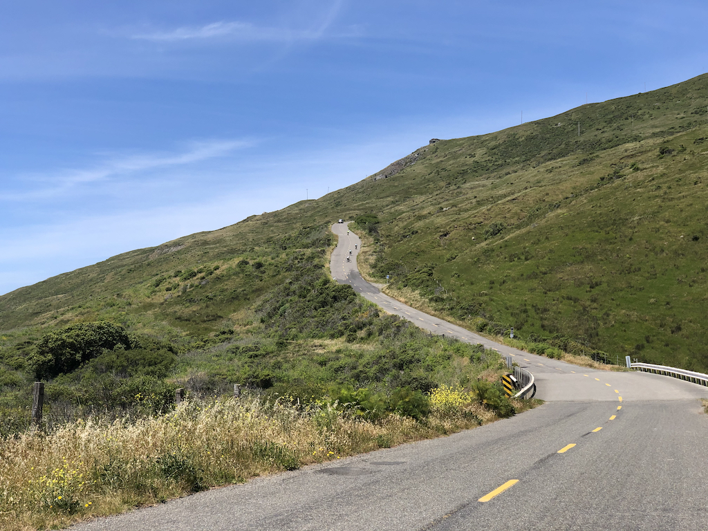 Cyclists climbing up the Wall during the Tour of the Unknown Coast bike ride in 2019