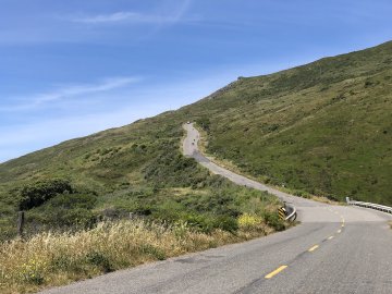 Cyclists climbing up the Wall during the Tour of the Unknown Coast bike ride in 2019