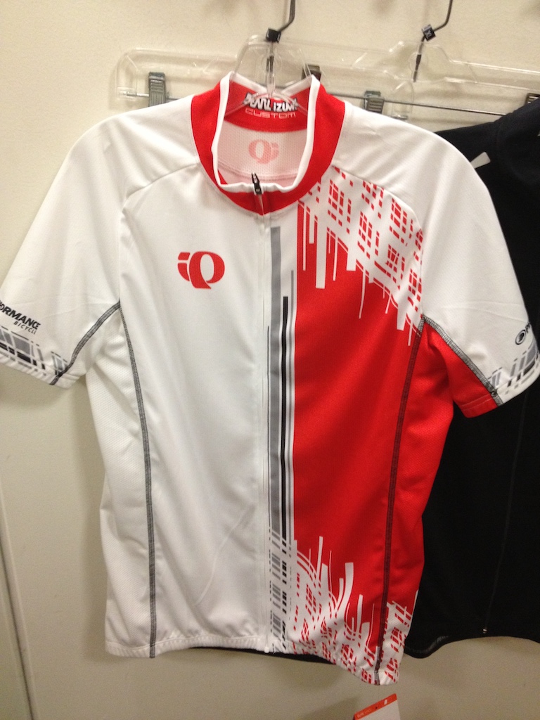 A white and red accented Pearl Izumi cycling jersey