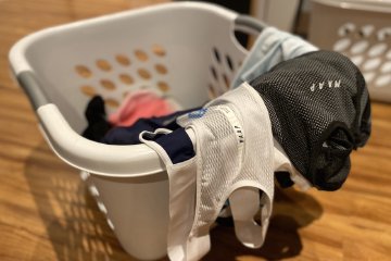 A few recommendations on how to properly care and maintain your cycling clothing, wash after wash. Image contains: laundry basket, Maap cycling clothing, base layer, bib short.