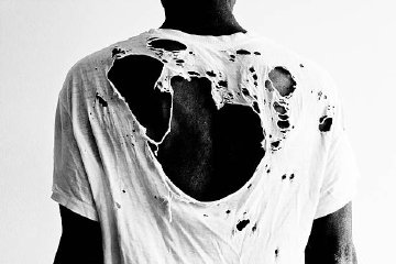 Tattered shirt stock image