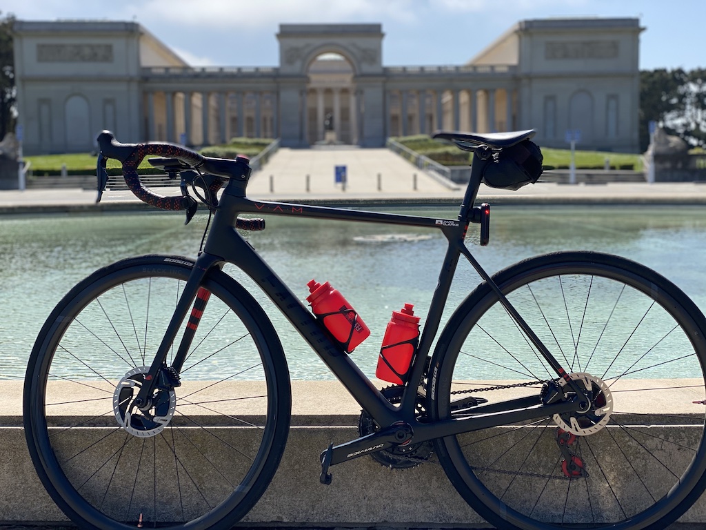 Factor O2 VAM bike leaning against a wall in front of a reflecting pool in front of the Legion of Honor in San Francisco, California