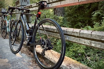 Factor O2 VAM on a bridge near Pescadero, CA during The Longest Day adventure.