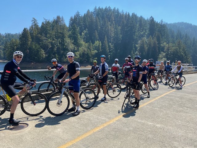 Cyclists posing with their bikes on Alpine Dam north of San Francisco, California