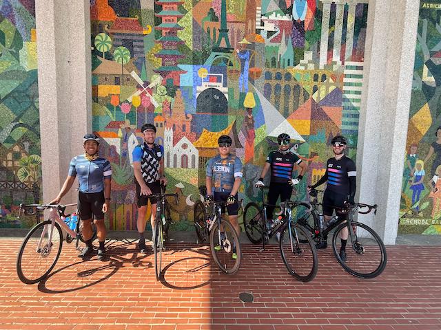 Cyclists posing after a group ride in downtown San Mateo, California