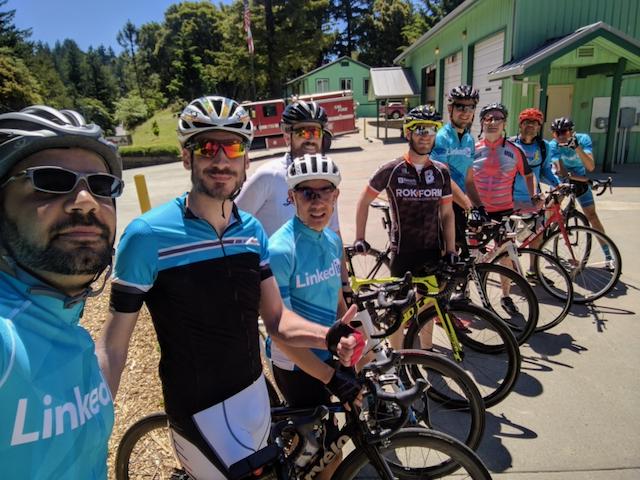 Cyclists from LinkedIn posing for a photo with their bikes near Santa Cruz, California