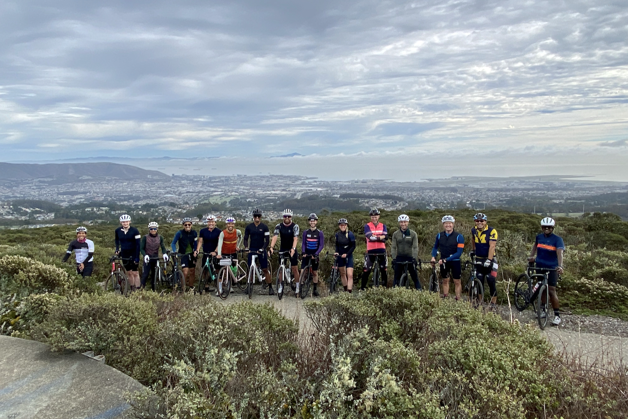 A group of cyclists at the top of Sweeney Ridge with their bikes near San Bruno, California