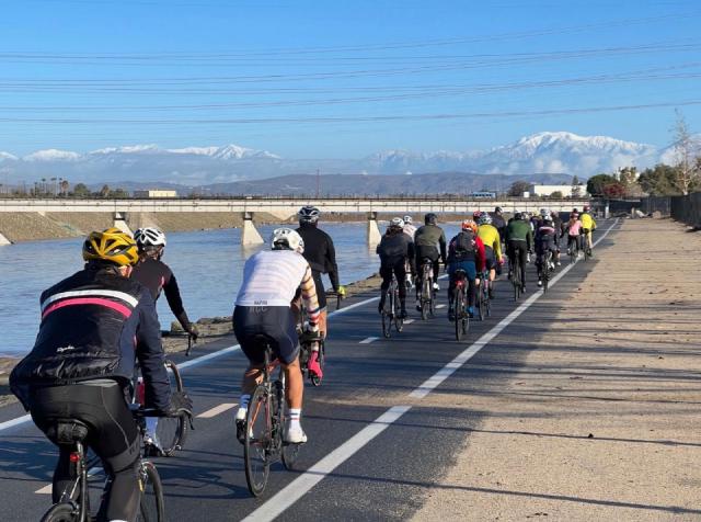 Cyclists pacelining north up the Santa Ana River Trail