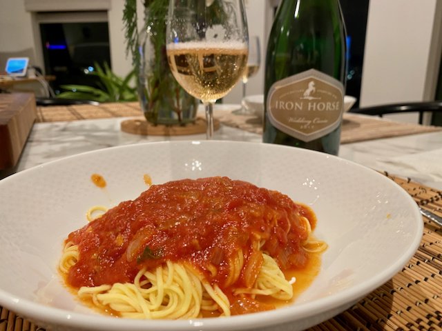 Homemade pasta with celebratory cuvee wine at the end of long week