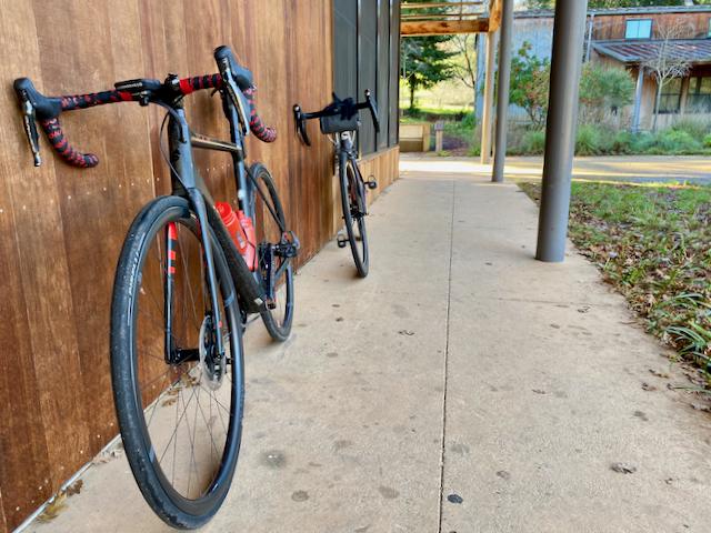 Two bikes resting against a wall at the Portola Library in Woodside, California