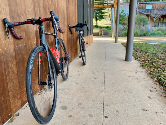 Two bikes resting against a wall at the Portola Library in Woodside, California
