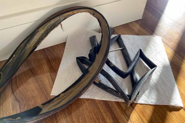 ugh, what a pain Used bike tire and inner tube with messy, dried sealant laying on the ground