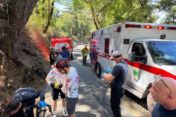 Cyclists and emergency responders on West Alpine Road in Palo Alto, CA responding to two cyclists who crashed.