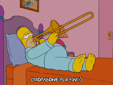 Homer Simpson playing a sad trombone sound in bed