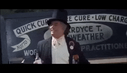 Animated gif of snake oil salesman selling out the side of a cart