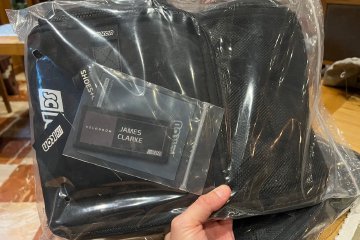 Unopened ScIcon Race Day Rain bicycle gear bad with custom label in packaging
