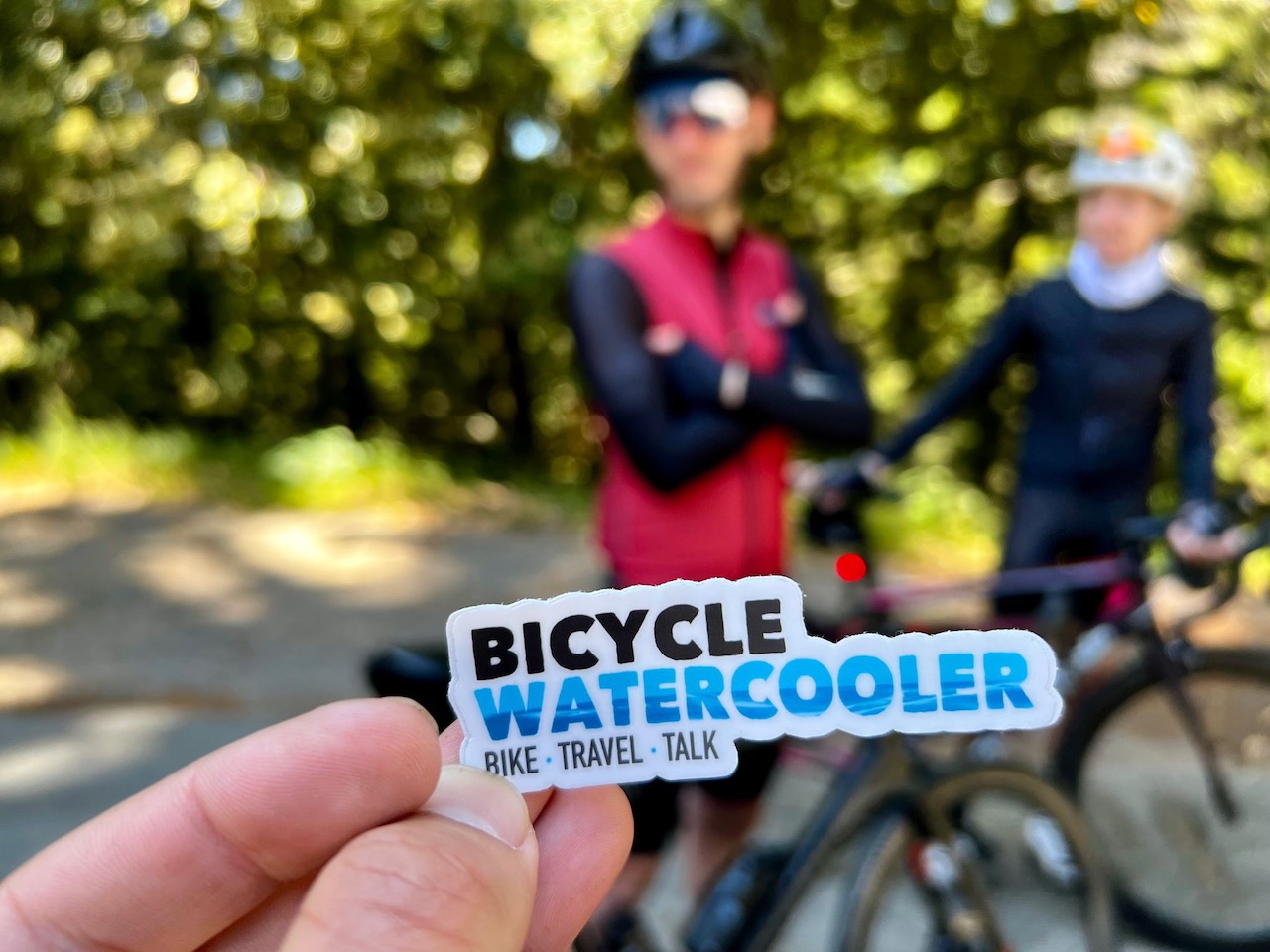 Picture of BicycleWaterCooler website logo sticker artistically shot at the top of Tunitas Creek Road in Woodside, California