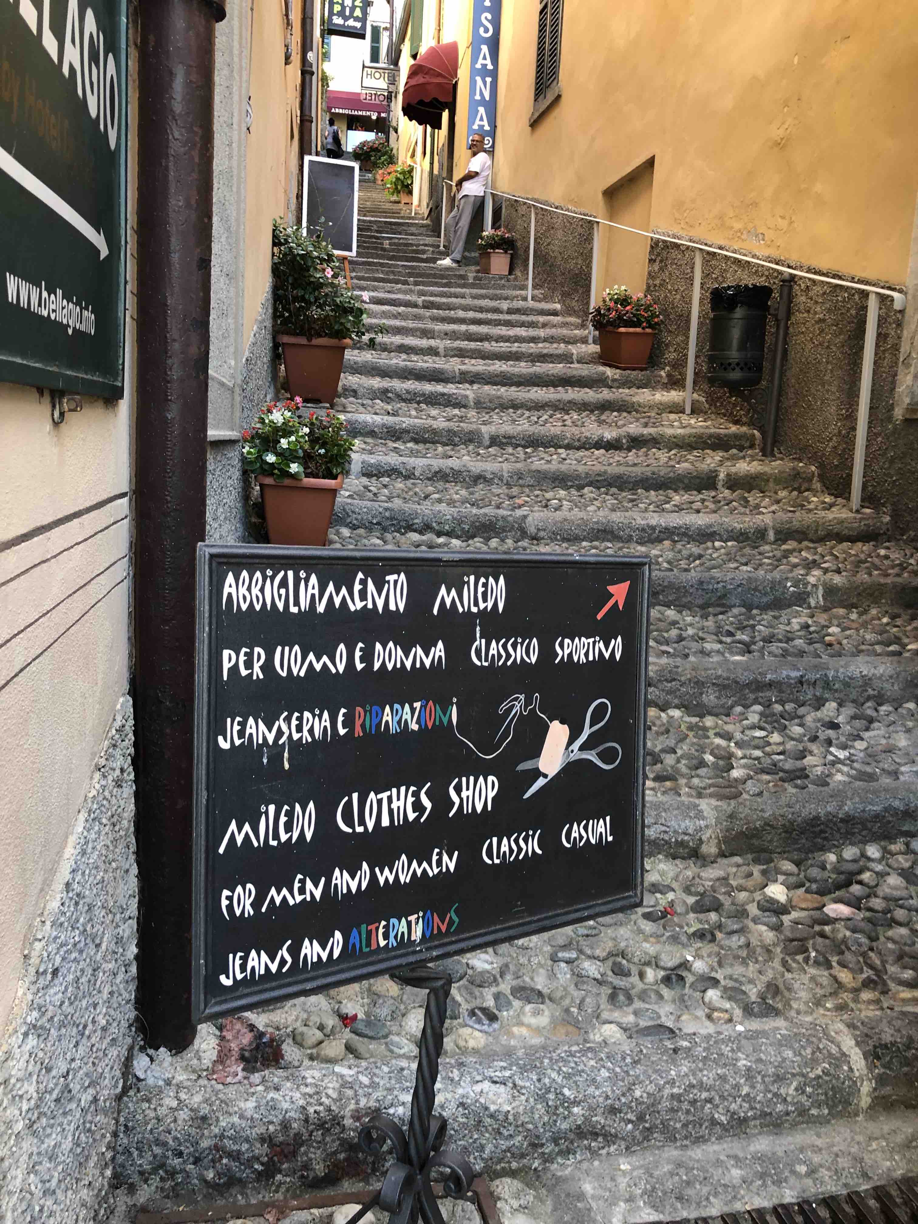 Pebbled steps leading upward to shops and restaurants in Bellagio, Italy