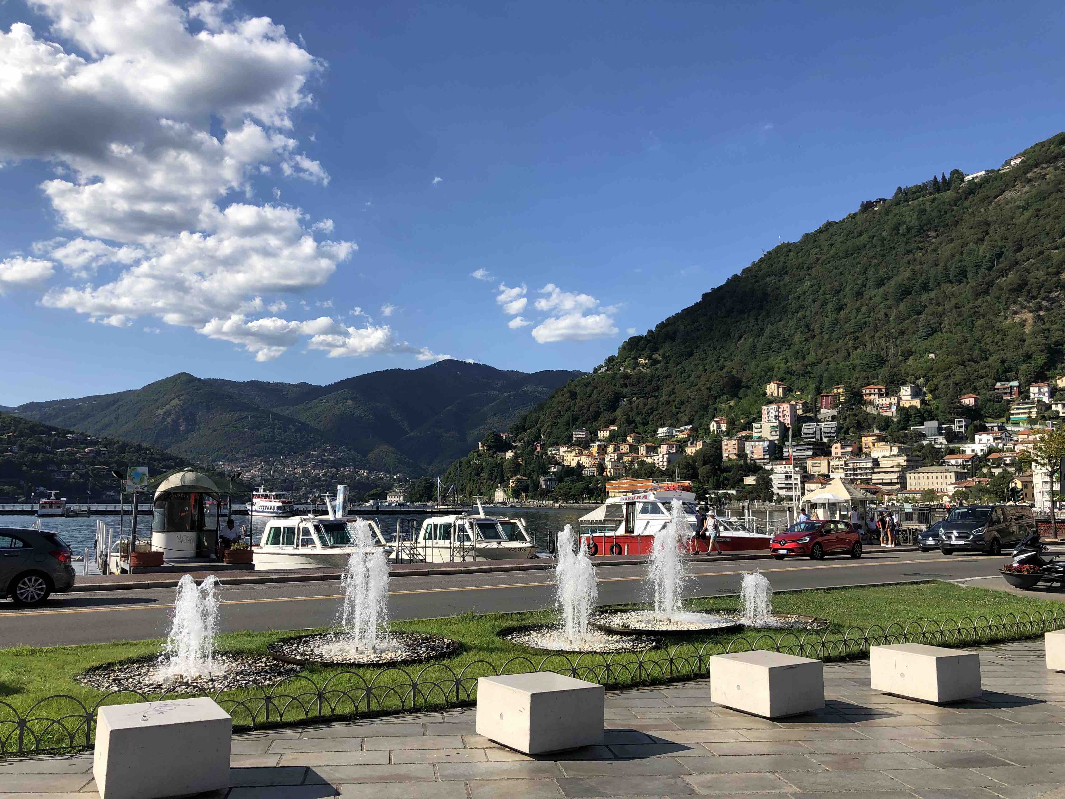 Le Fontanelle di Piazza Cavour Como overlooking the lake with docked boats