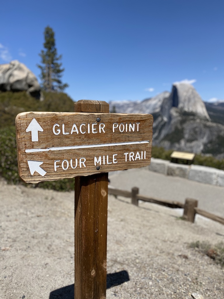 Sign at Glacier Point directing visitors to Four Mile Trail and Glacier Point