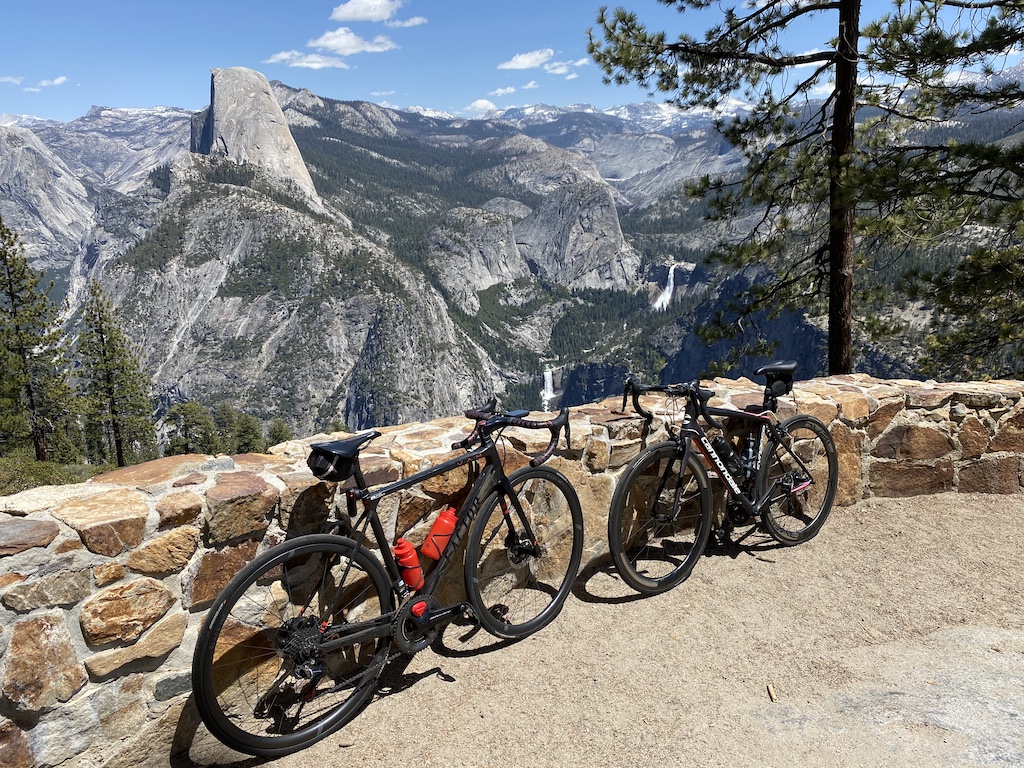Bikes along the wall at Washburn Point in Yosemite National Park with views of Half Dome, Vernal Falls, and Nevada Falls.
