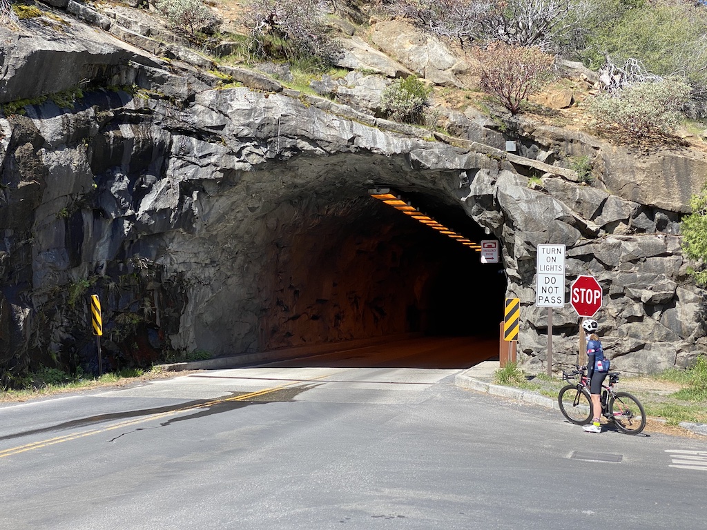 Cyclist near the entrance of the Yosemite National Park Tunnel.