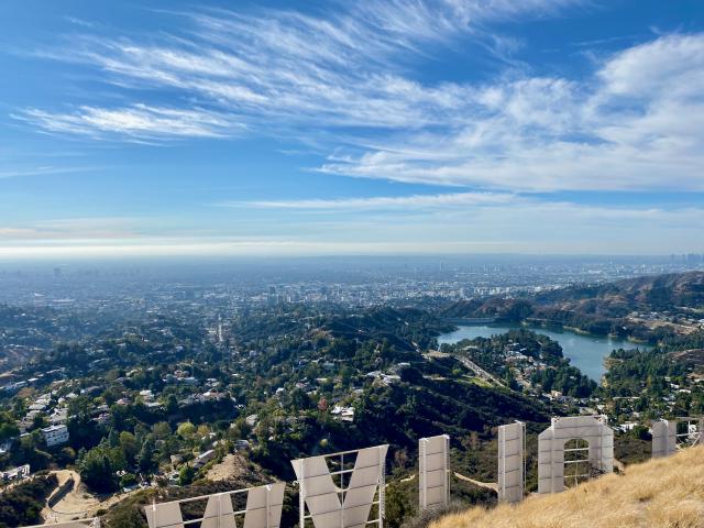The view over the top of the Hollywood Sign at the top of Mt. Lee Drive in Los Angeles, California