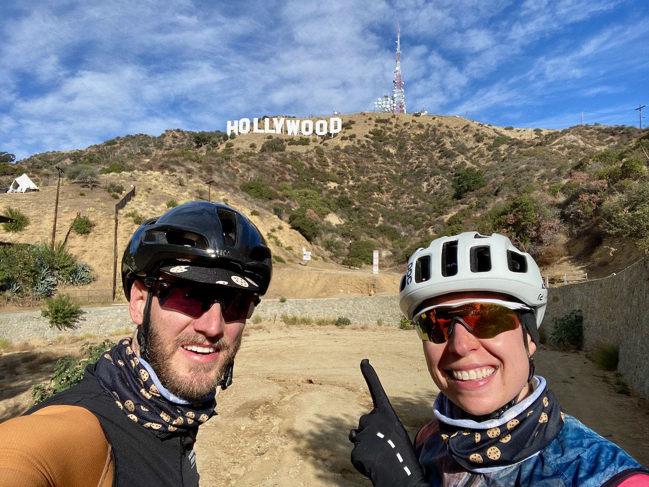 A cyclist couple about to ride up to the Hollywood Sign in Los Angeles, California