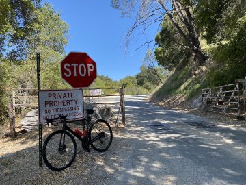 I couldn't believe how remote it felt out there! Factor O2 VAM bicycle leaning against a sign by Lime Mountain quarry, near Lake Nacimiento, California