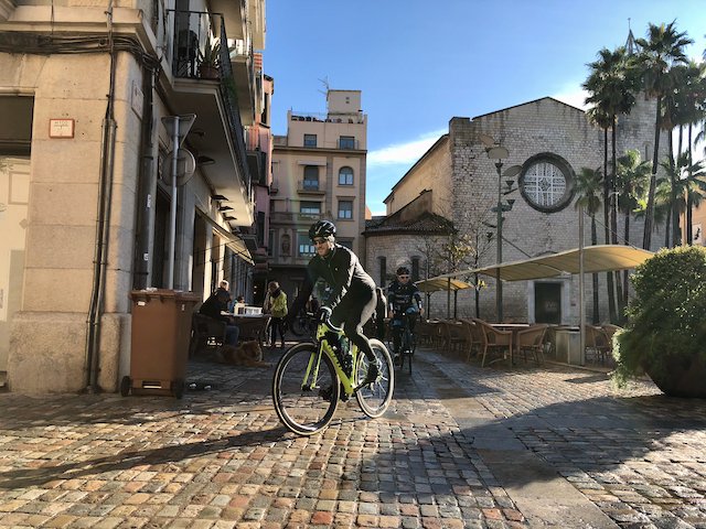 Cyclist leaving the town of Girona on a ride out to Sant Hilari de Sacalm