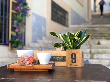 Nom nom nom, Girona style A pastry and coffee on a table from La Fabrica in Girona, Spain