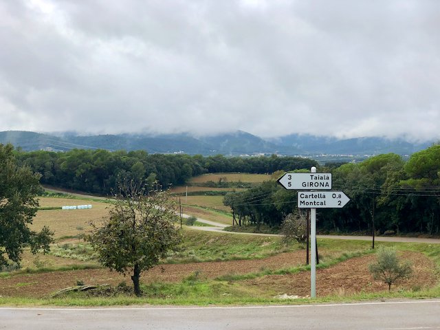 Road sign showing Girona and neighboring towns