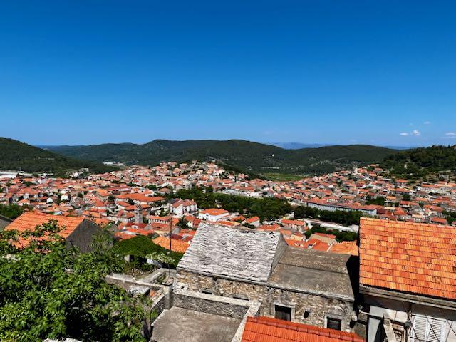Elevated view looking down on the red roof buildings of Blato, Croatia