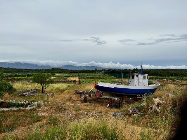 Boat sitting in a field near Stari Grad, Croatia