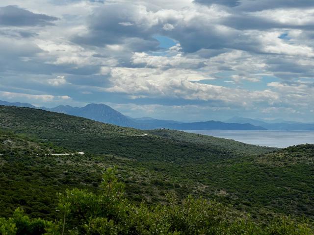 View out over the Adriatic with a snaking road cutting through the landscape