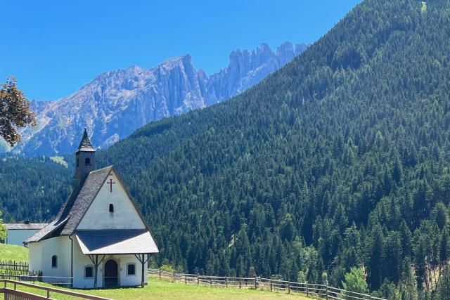 Church nestled in the Dolomite mountains of Northern Italy
