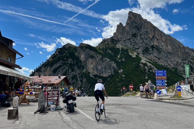 Cyclist riding near the top of the Passo Falzarego on his way back to the Alleghe