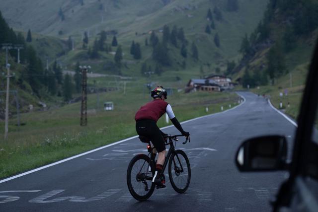 Cyclist zigzagging across the road on the way up to the Passo Fedaia